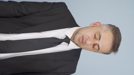 Vertical-video-of-Tired-businessman.